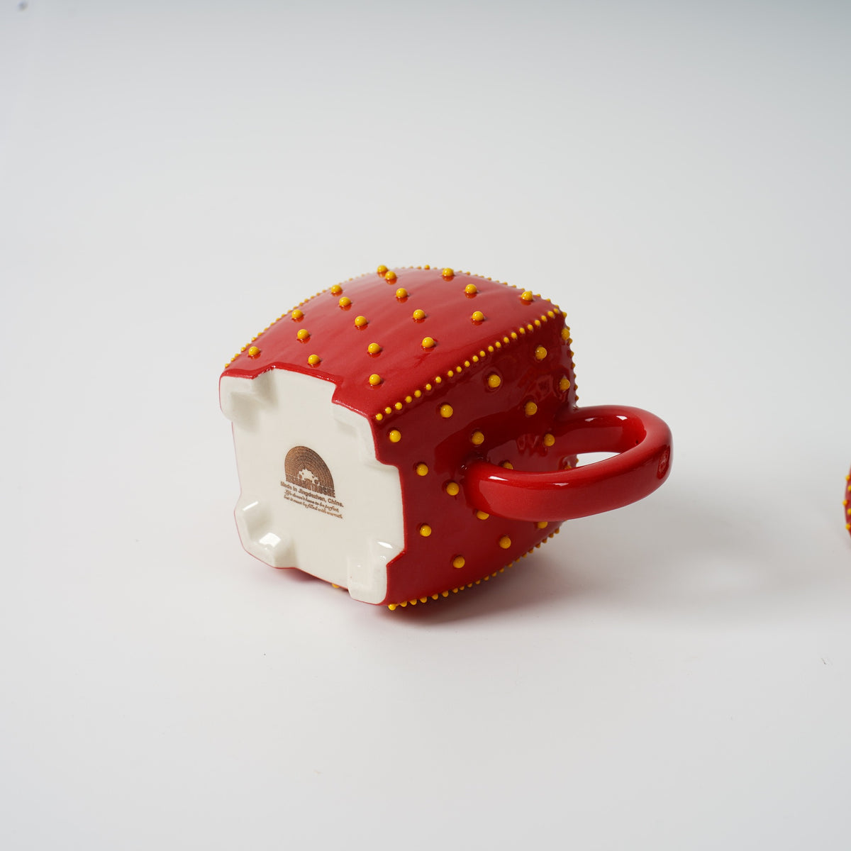 Handmade red square ceramic teapot detail