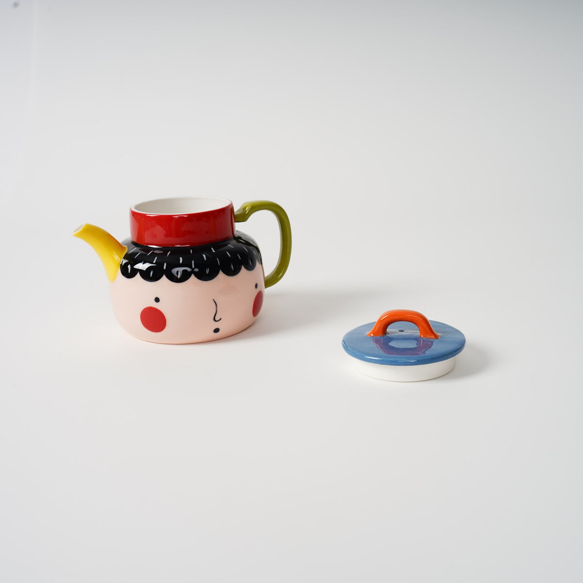Two-Faced Ceramic Teapot with cups