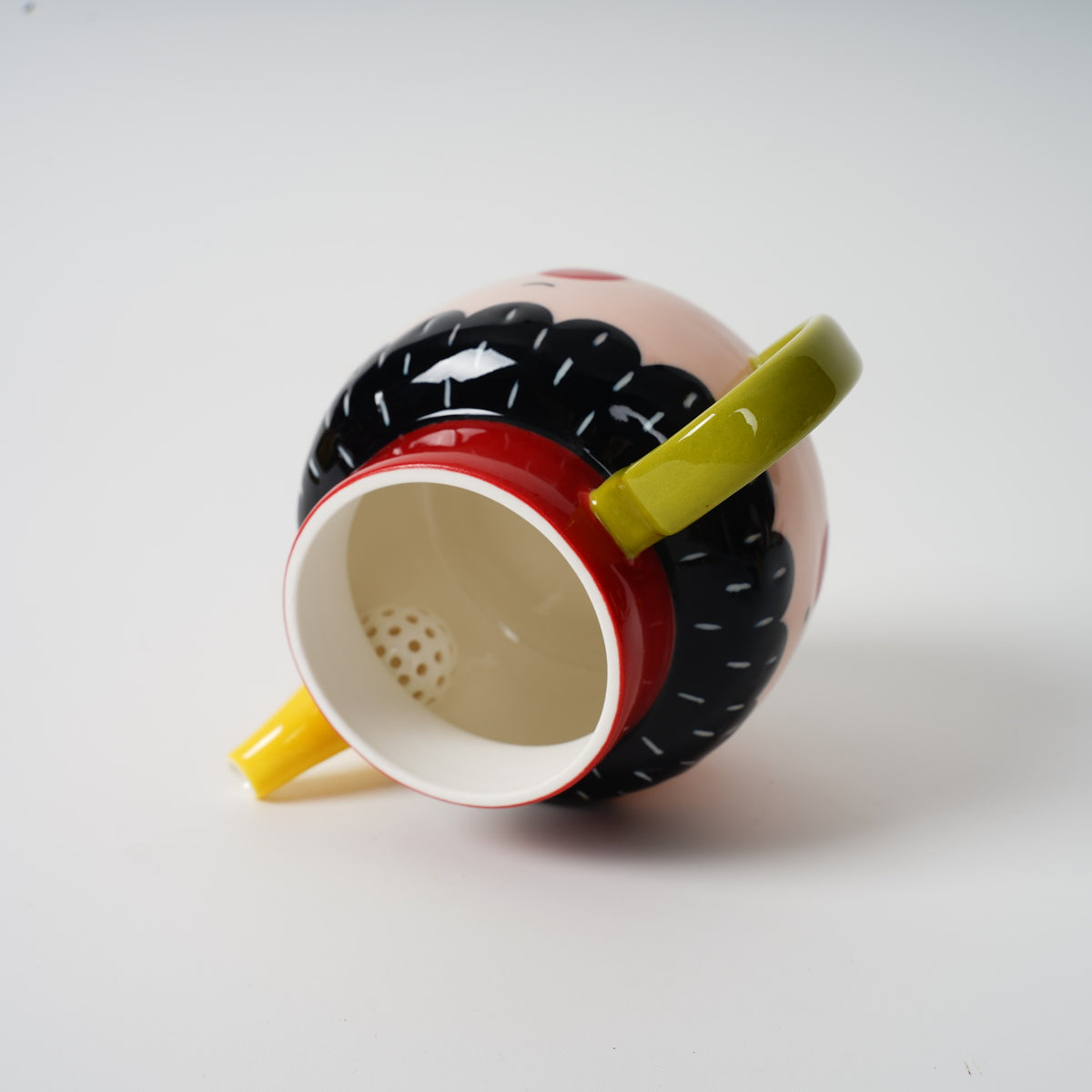 Two-Faced Ceramic Teapot with red and yellow cups