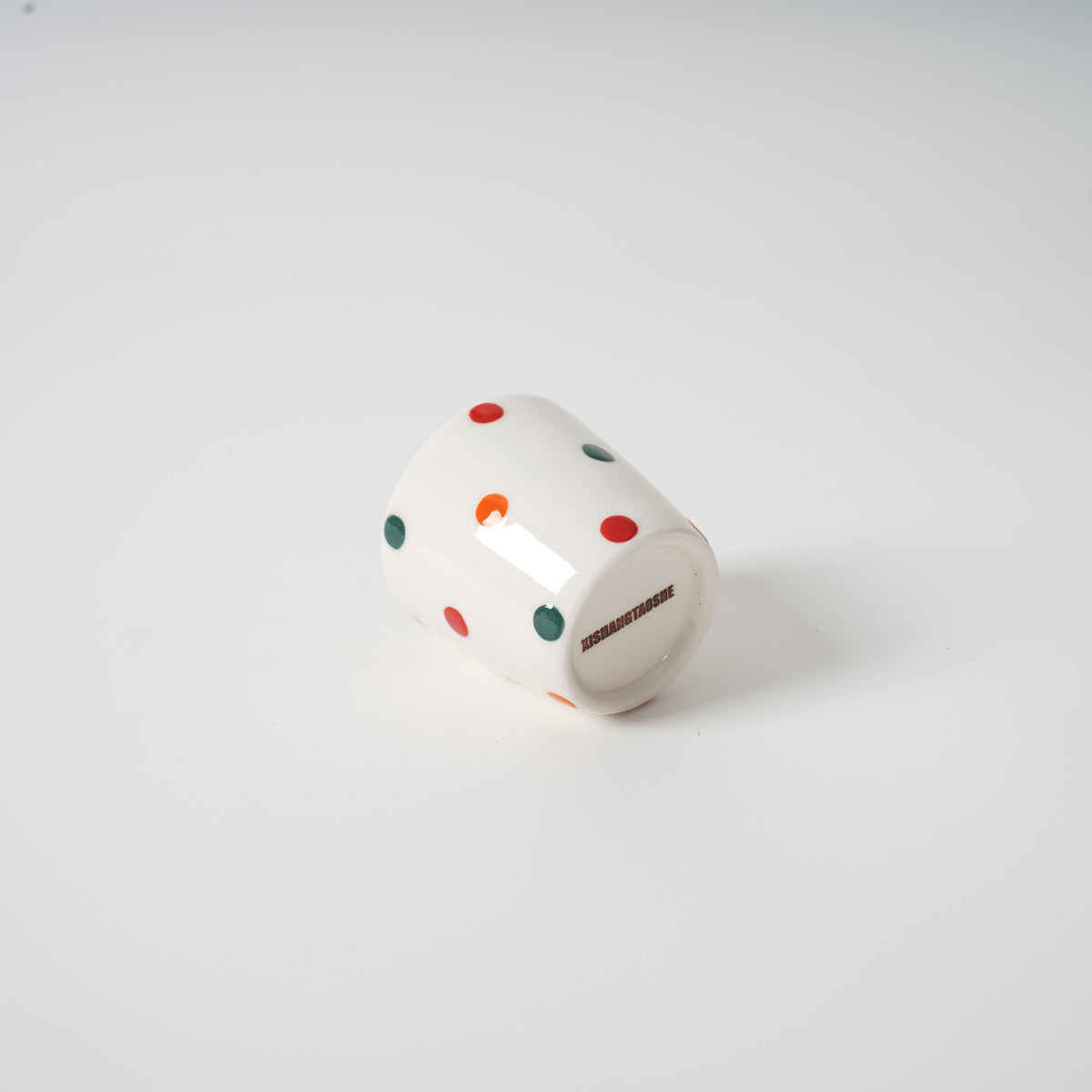 Handmade polka dot ceramic cup detail
