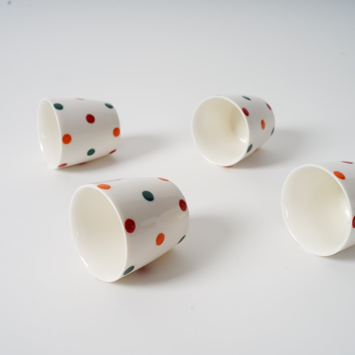 Matching hand-painted polka dot ceramic cups