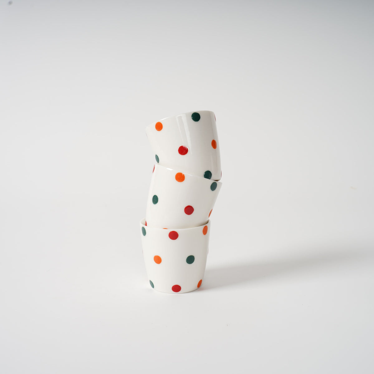 Polka dot ceramic teapot and cups front view