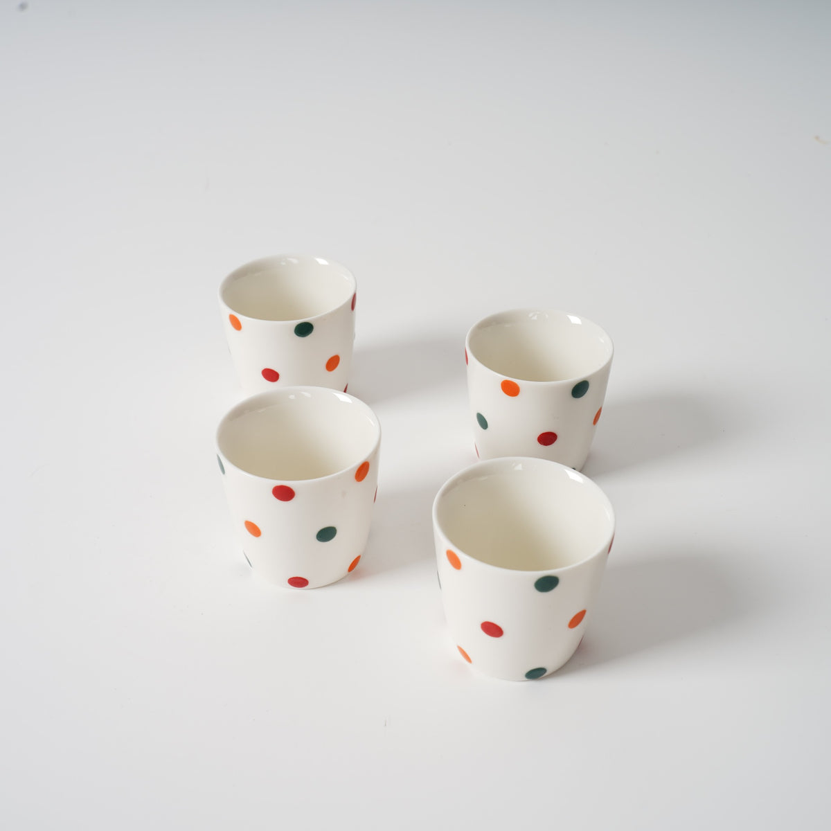 Handmade ceramic tea set with colourful polka dots