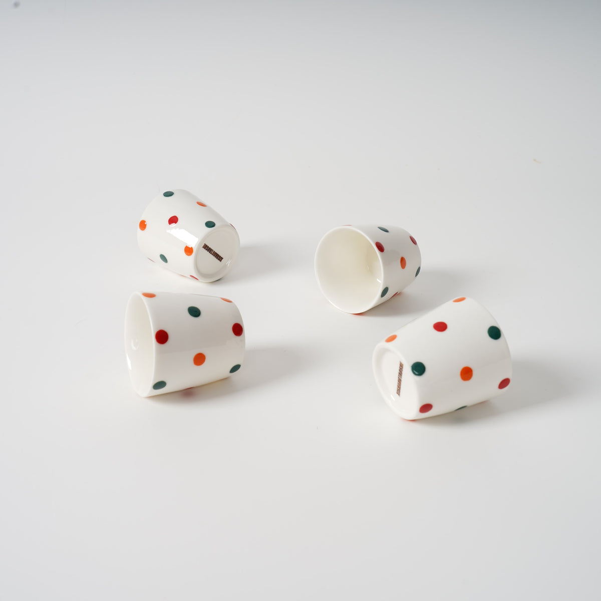 Polka dot ceramic teapot with striped character lid