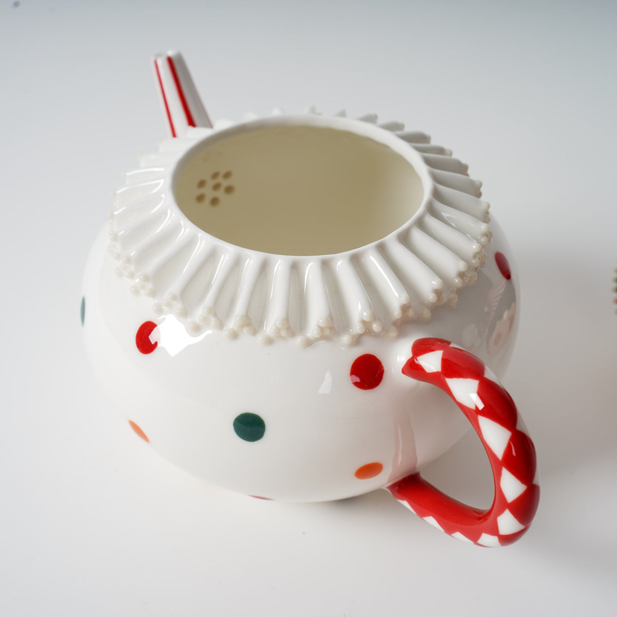 Handmade polka dot ceramic tea set detail