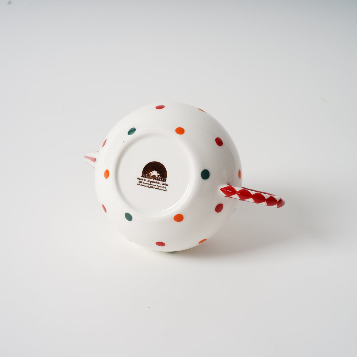 Handmade polka dot ceramic tea set detail