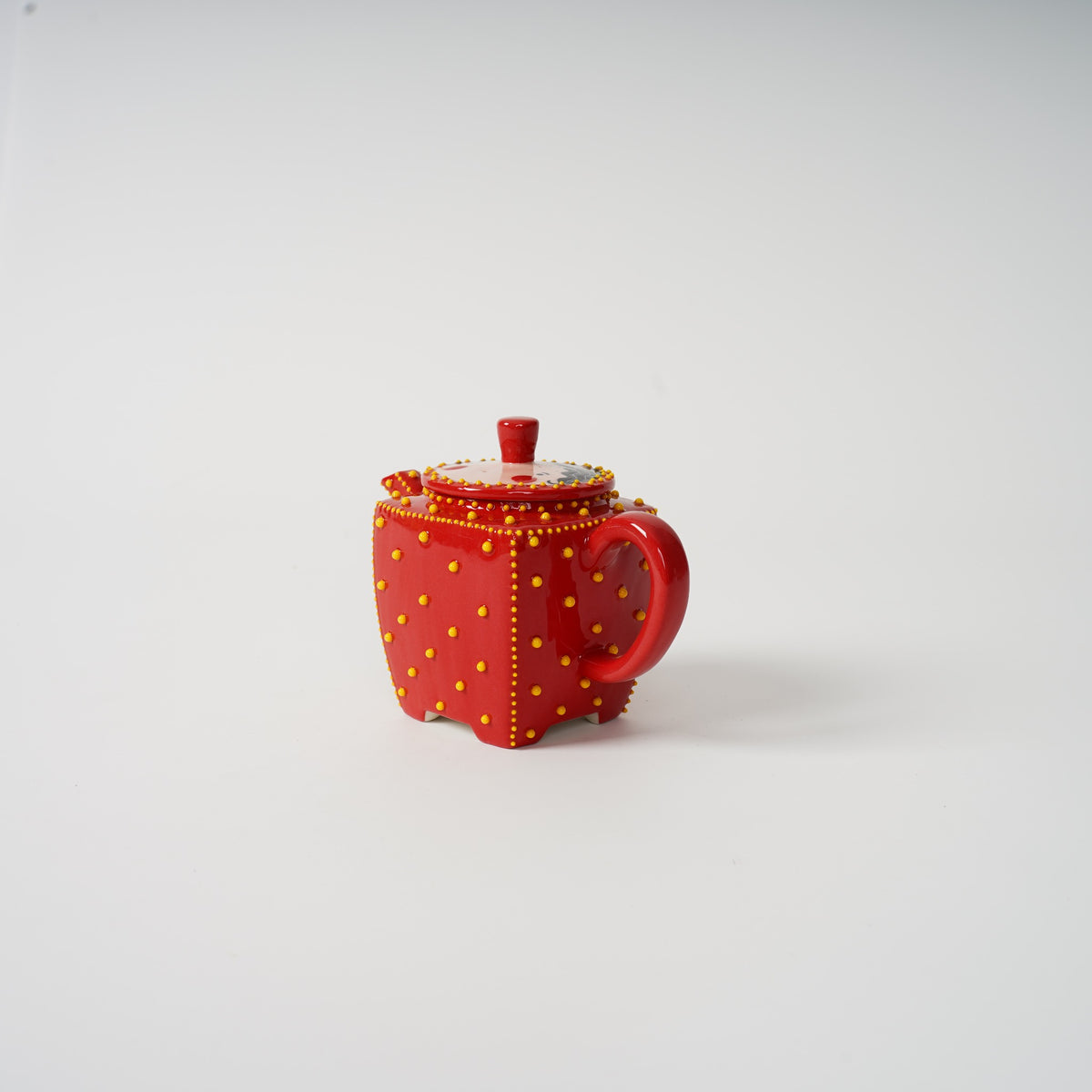 Handmade red square ceramic teapot detail