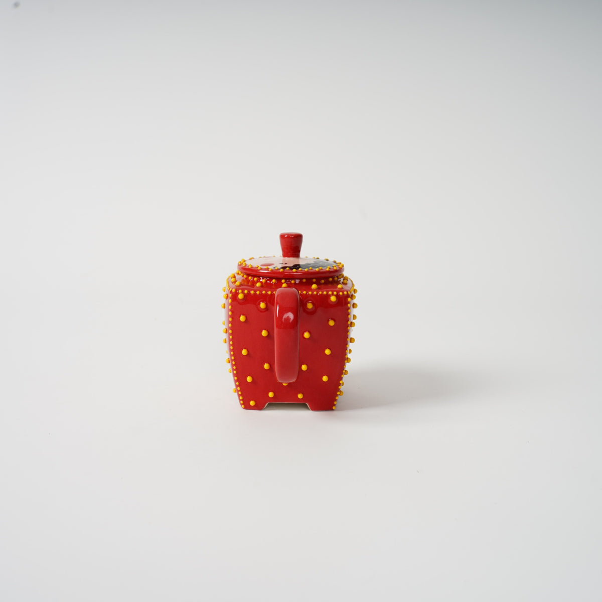 Handmade red square ceramic teapot detail