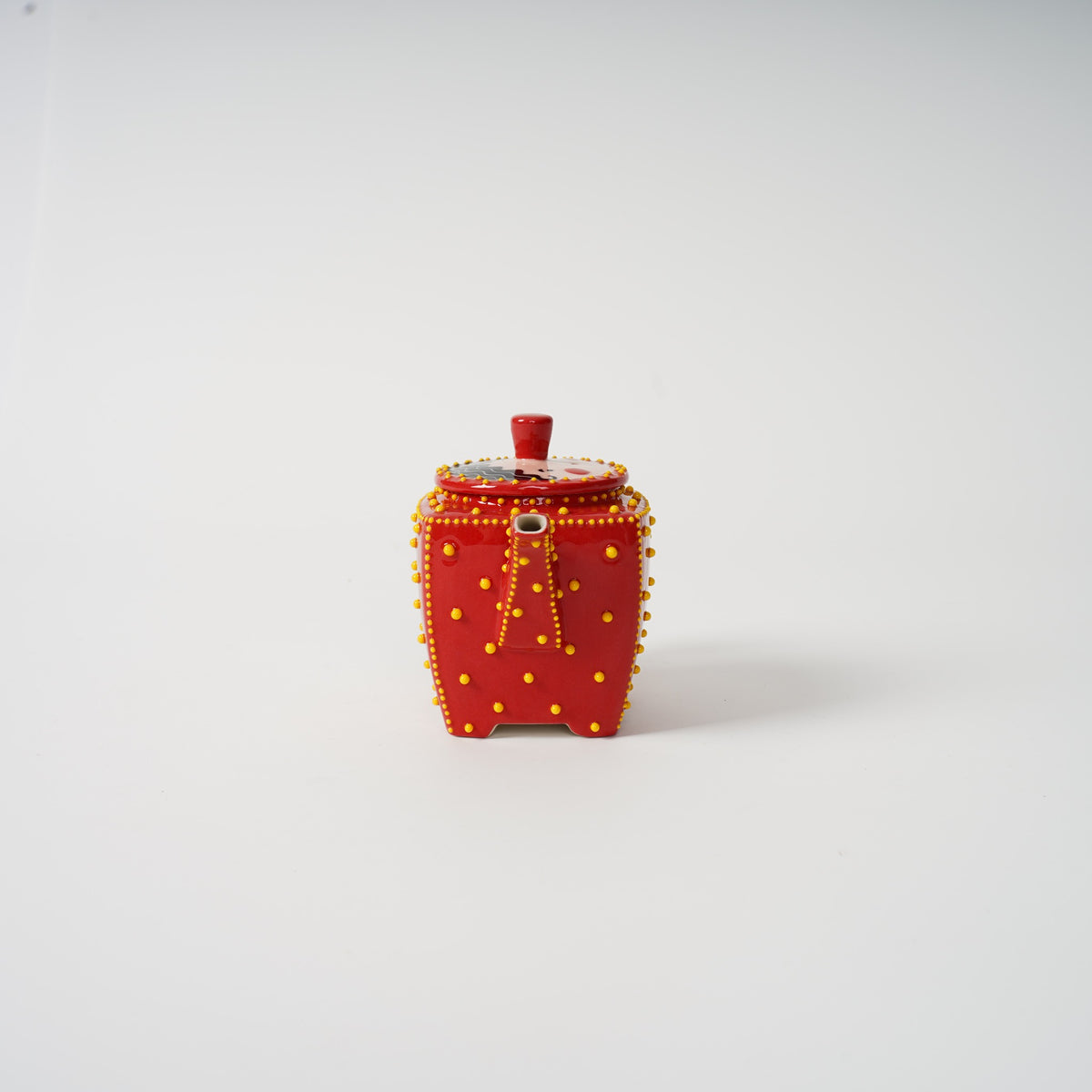 Handmade red square ceramic teapot detail