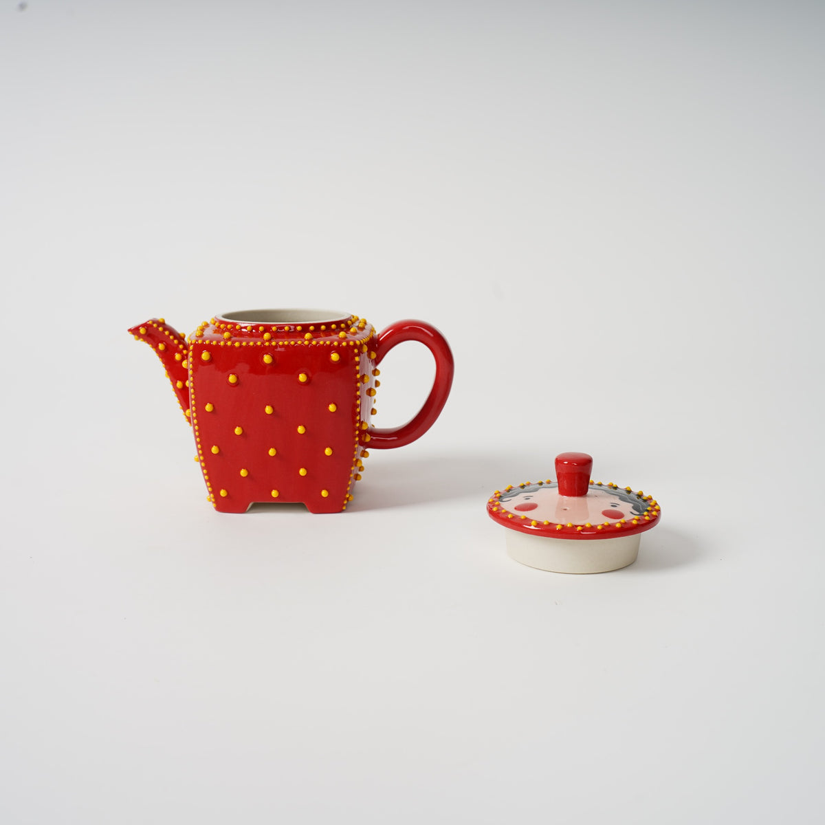 Handmade red square ceramic teapot detail