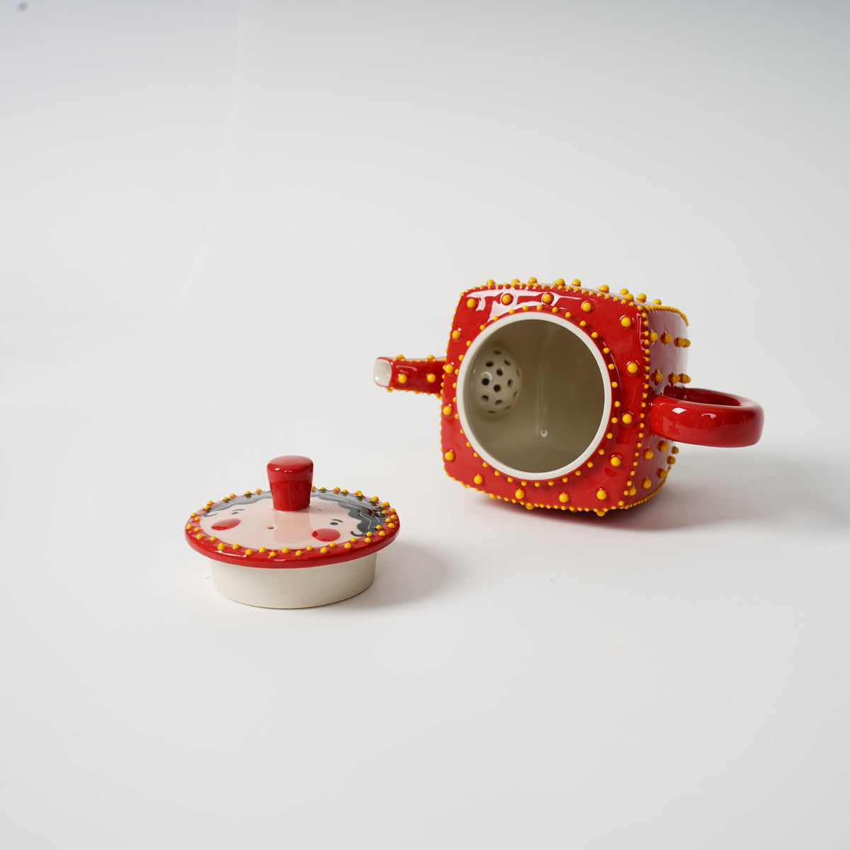 Handmade red square ceramic teapot detail