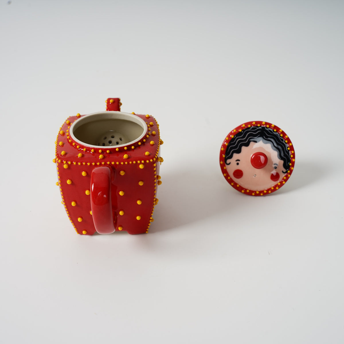 Handmade red square ceramic teapot detail