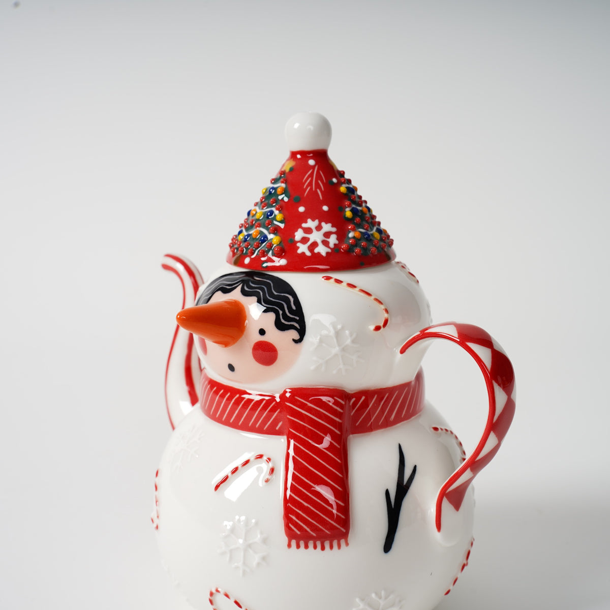Hand-painted snowman ceramic tea set detail