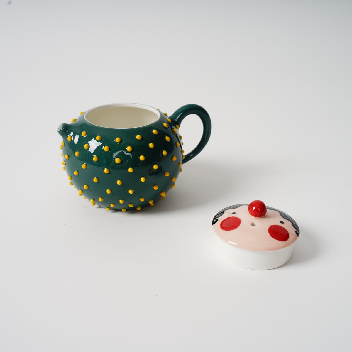 Dark green Spiky Face Ceramic Teapot interior detail