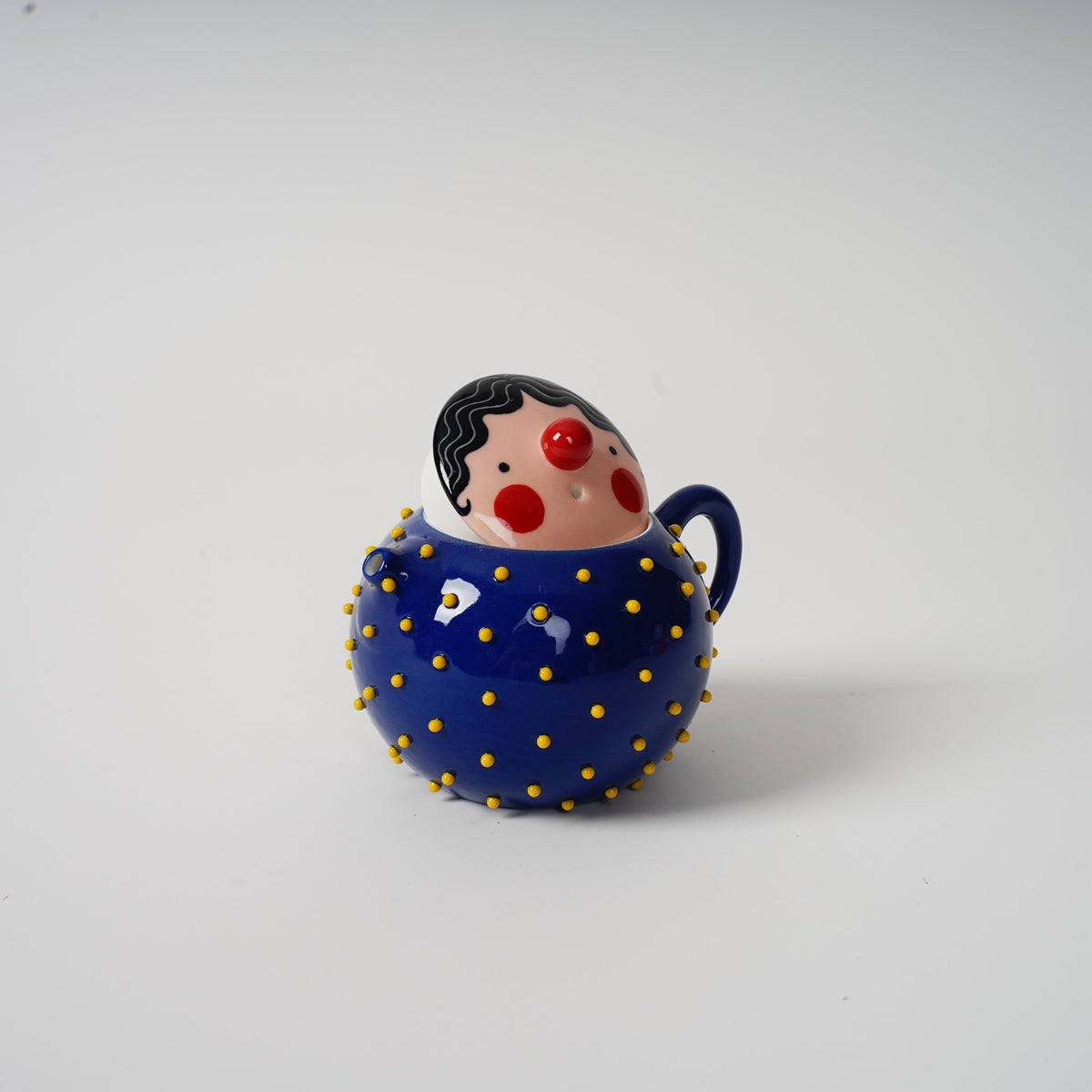 Royal blue Spiky Face Ceramic Teapot with face lid raised